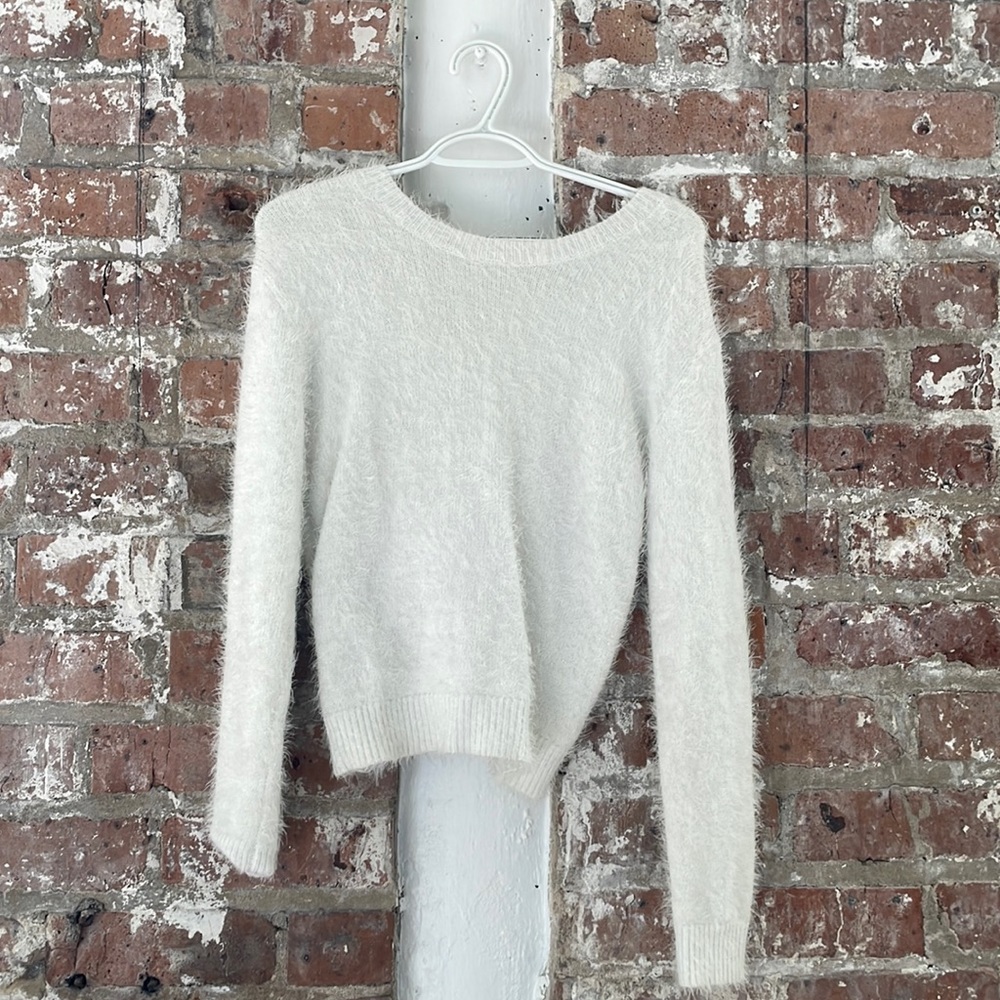 White sparkly sweater with knotted back